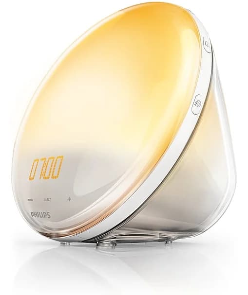 Philips SmartSleep Wake-up Light, en rund vekkerklokke som gløder i varmt gult lys